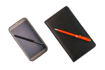 A smartphone with a stylus pen and a black notebook with red pen