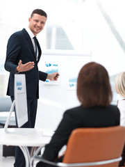 Manager is discussing a new financial project with a business team.