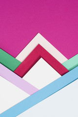 colored different triangles isolated on pink