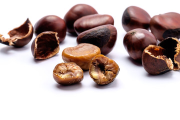 Roasted chestnuts on a white background.