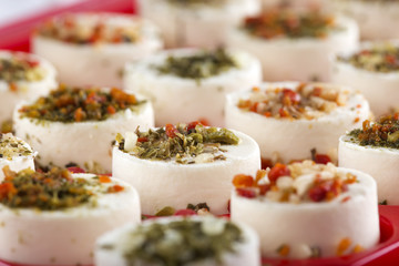 Cheese appetizer with herbs and dried vegetables