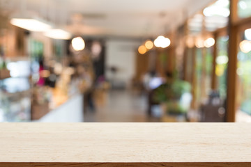 Empty wooden table with background blur of coffee shop , product display template.