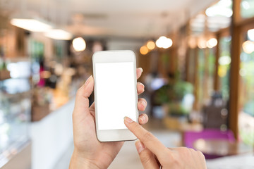 woman hand using smartphone on coffee shop blur background