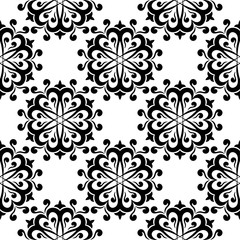 Black floral seamless design on white background