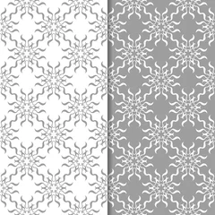 Poster White and gray floral ornaments. Set of seamless backgrounds © Liudmyla