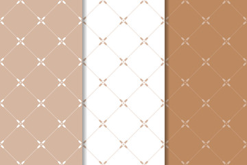 Brown and white geometric ornaments. Set of seamless patterns