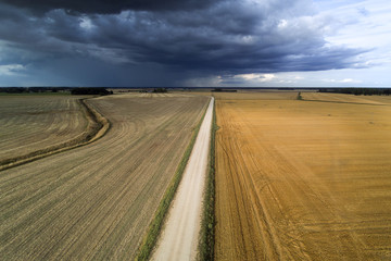 Fototapeta na wymiar Dark clouds over land , Tukums area, Latvia.