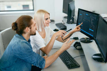 IT Team Working In Office. People Programming On Computer