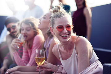Joyful young woman resting at the party