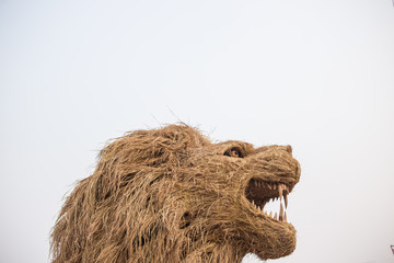 Straw puppet is the lion in a field farm