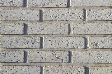 Fragment of a wall made of stone. Stone wall.