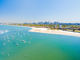 Fototapeta na wymiar St Kilda beach aerial with Melbourne City Skyline in the background