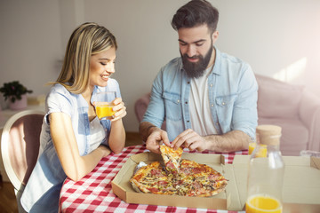 Couple eating pizza