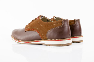 Male brown leather shoe on white background, isolated product, comfortable footwear.