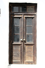Old door isolated, Sifnos island, Greece.