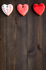St Valentine's Day cookies in shape of heart on dark wooden background top view copy space