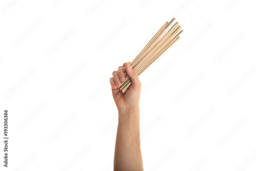 Wall mural Hand holding a wooden meter on white background