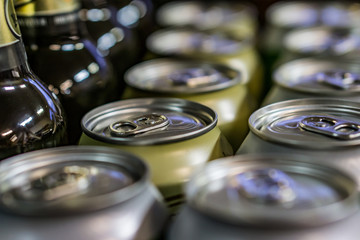 Close-up of cups and beer bottles in a shop. Shallow depth of focus.