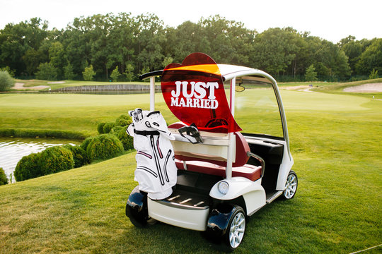 Just Married Sign On Back Of A Golf Cart