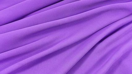 Fototapeta na wymiar Beautiful purple background of light fabric.