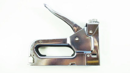 Furniture stapler on a white background.