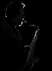Adult sax player with his instrument