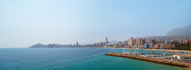 Panoramic landscape of Mediterranean sea and Benidorm city skyline