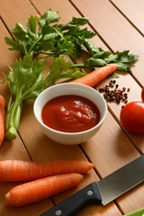 tomato sauce with vegetables around