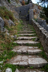 Fototapeta na wymiar narrow stone road to the fortress wall
