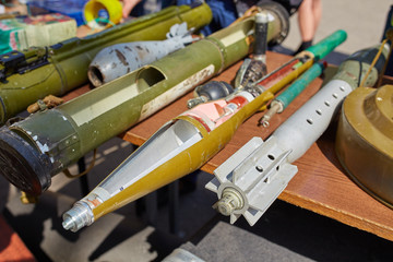 A mortar mine and a hand grenade launcher at the stand.