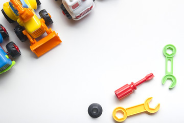 Fototapeta premium Kids educational developing toys frame on white background. Top view. Flat lay. Copy space for text