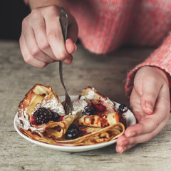 Pancakes (crepes) on a wooden surface