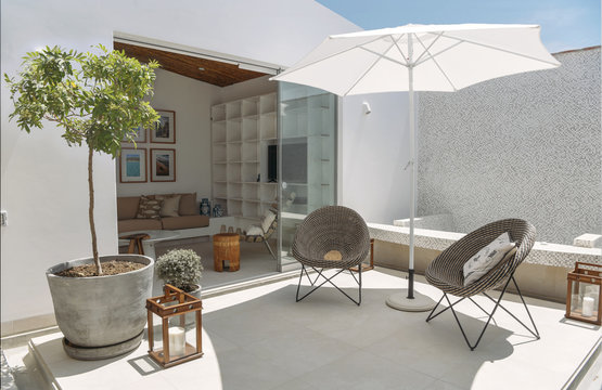 Sunny patio with umbrella