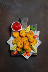 Crispy Fried Chicken Nuggets with Tomato Sauce on Dark Background Top view Flat Lay Copy Space