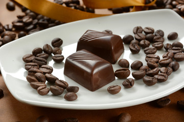 coffee chocolates with coffee beans next to it