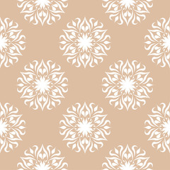 White floral ornament on beige background. Seamless pattern
