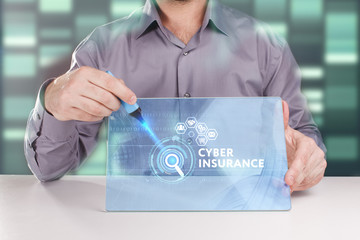 The concept of business, technology, the Internet and the network. A young entrepreneur working on a virtual screen of the future and sees the inscription: Cyber insurance