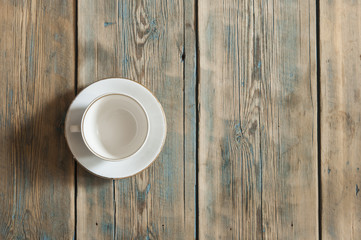 Empty coffee cup on wooden table.