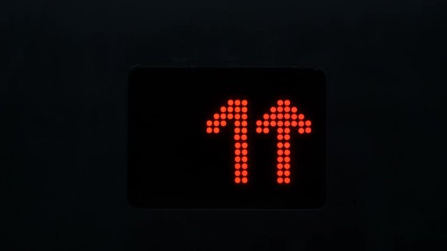 Digital numbers in dark on the display of the elevator
