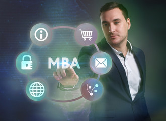 Business, Technology, Internet and network concept. Young businessman working on a virtual screen of the future and sees the inscription: MBA