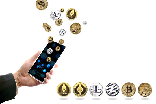 Cryptocurrency / View of hand of business man holding smartphone with crypto currency flying on white background.