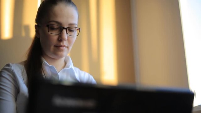 business woman works in office office computer. Compiles a financial report and scolds his employees by phone. Emotions, shouts, swears.
