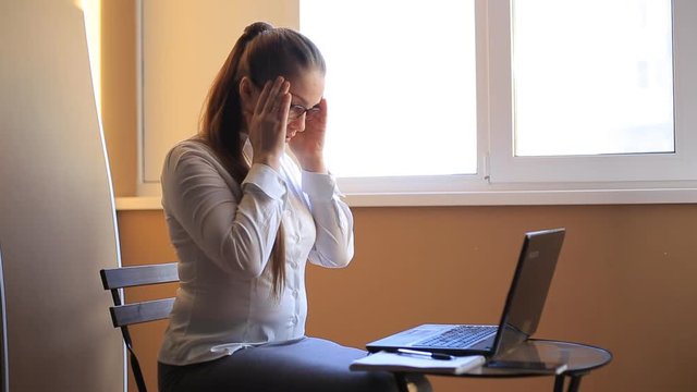 business woman works in office office computer. Compiles a financial report and scolds his employees by phone. Emotions, shouts, swears.
