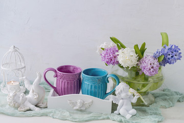 background with angels, hyacinths and two cups. March 8, wedding, birthday, mother's day, valentine's day,
