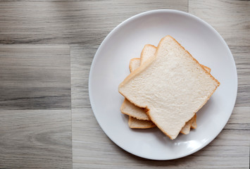 Toasted 3 slice of bread on white plate - obrazy, fototapety, plakaty