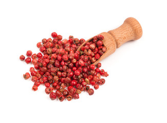 Pink pepper, Red peppercorns in a wooden spoon