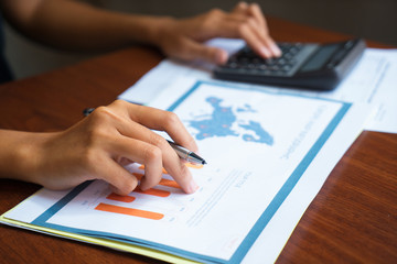 Female or analyst working with documents