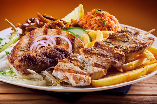 Greek grill plate with souvlaki and souzuki steak