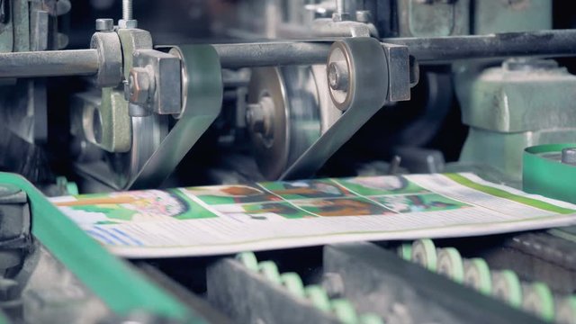 The circulation of the newspaper on a typography conveyor. 4K.