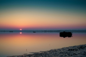 Sunset on the Casalborsetti lagoon. Po valley, Ravenna, Italy.